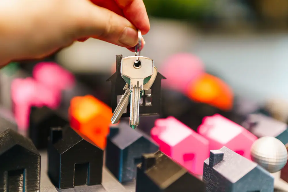 A model house beside a set of keys