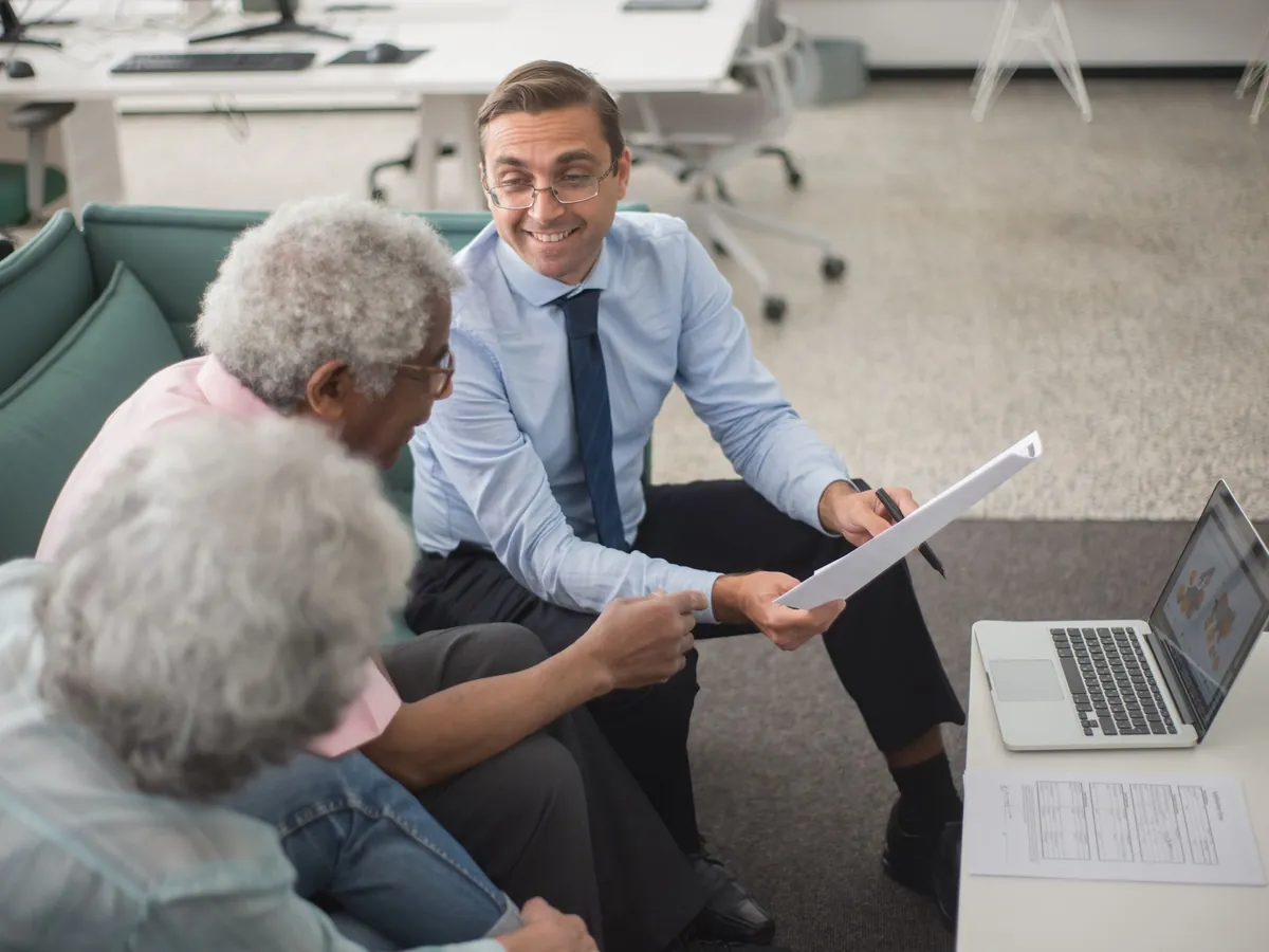 An adviser walking clients through a financial plan