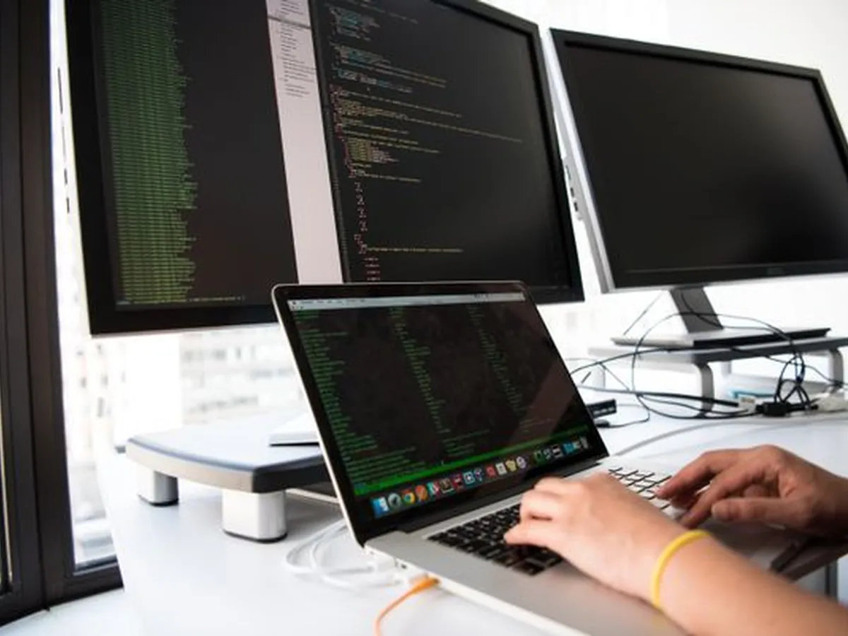 A developer working across multiple code monitors
