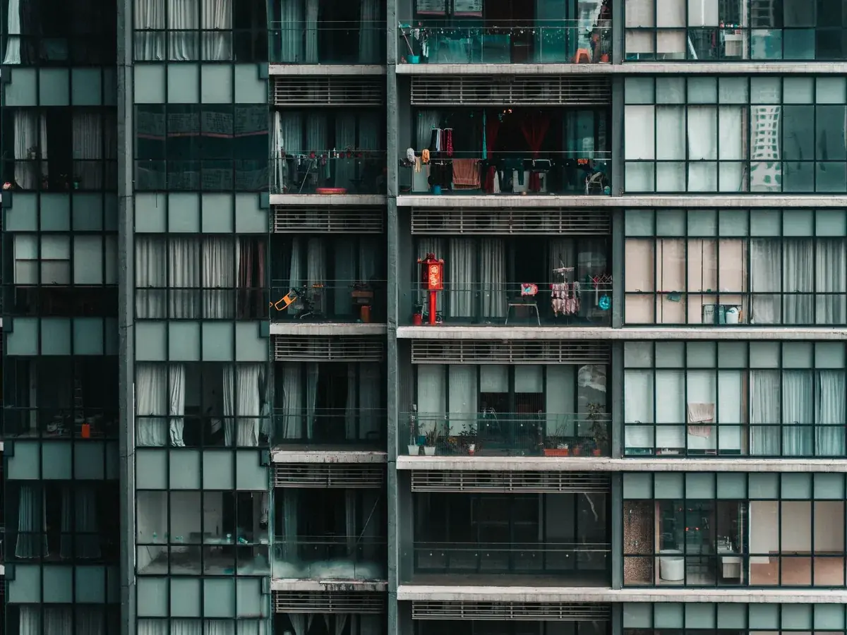 An apartment facade with rows of balconies