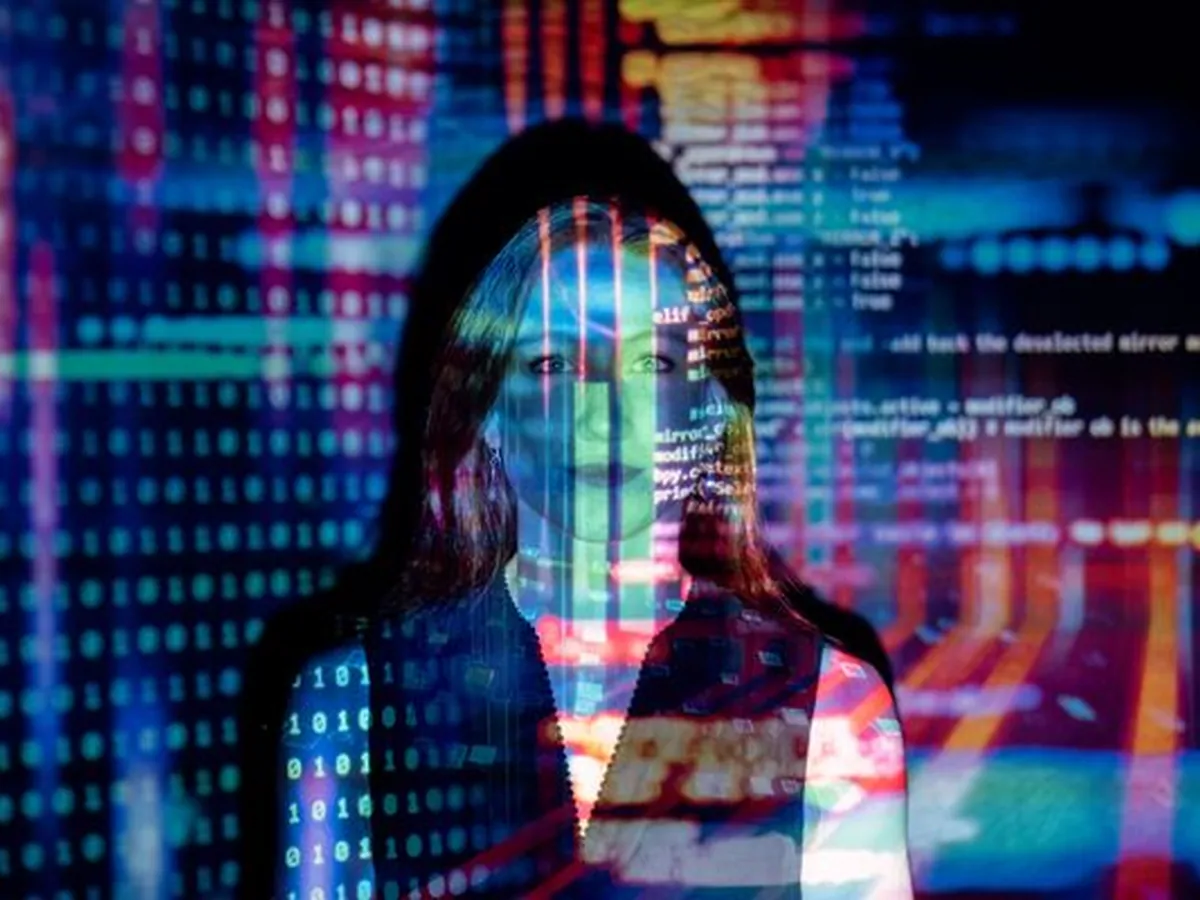 A strategist standing in front of a wall of projected data
