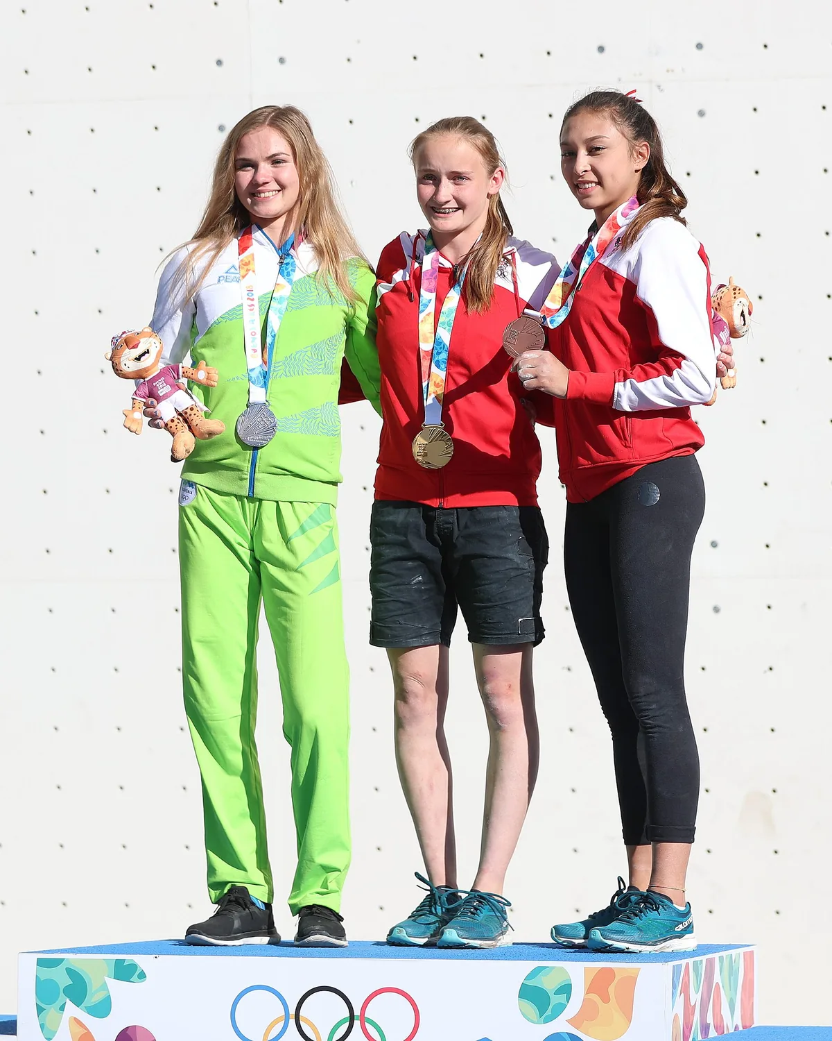An athlete on the podium after a medal ceremony