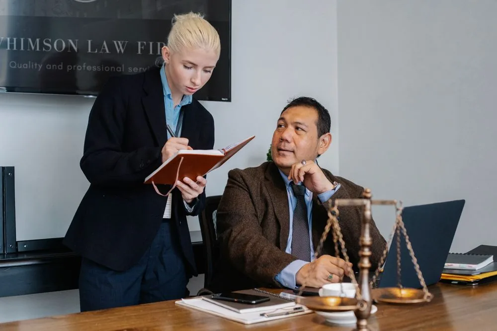 An in-house legal team reviewing documents together