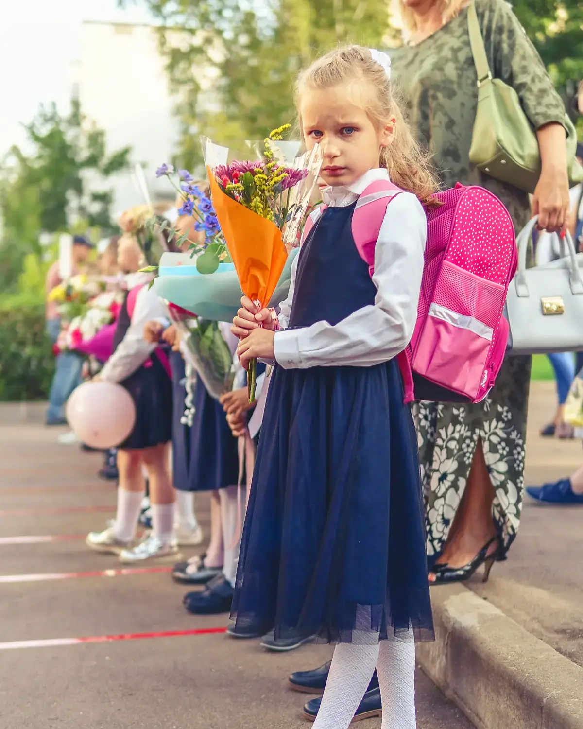 A young pupil with a school backpack on the first day of term