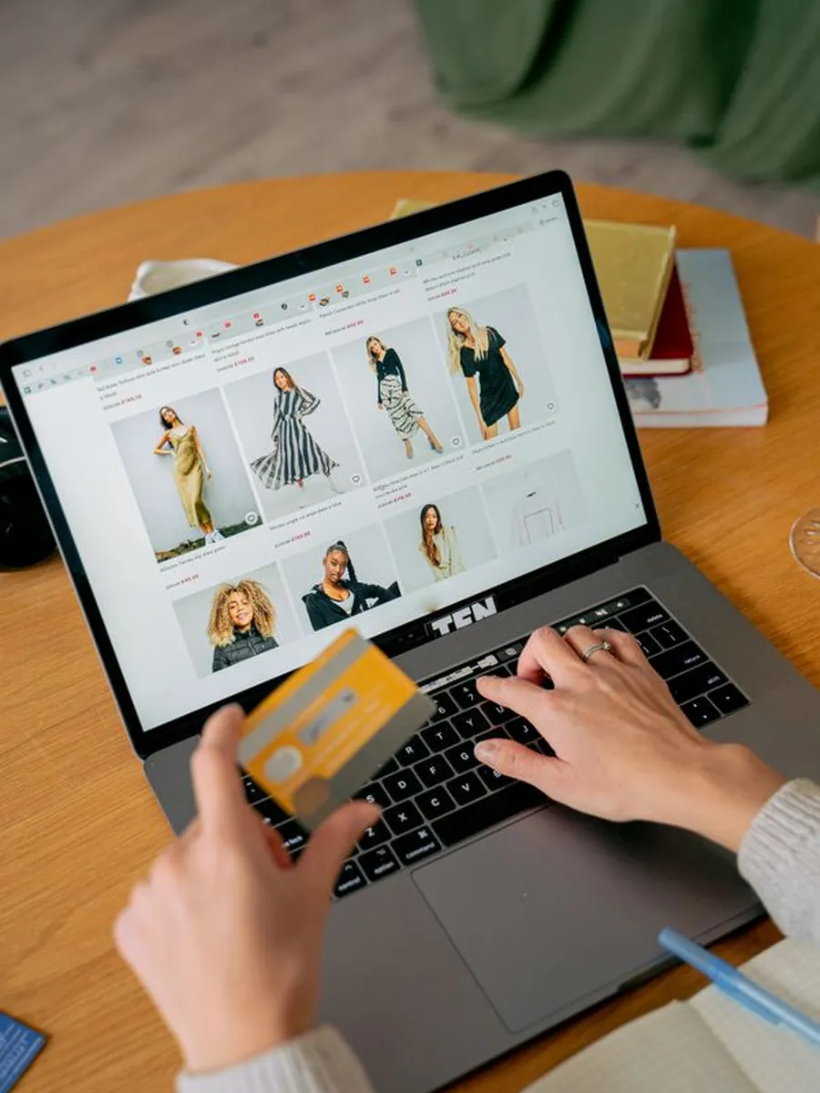 A shopper checking out on an online store with a card