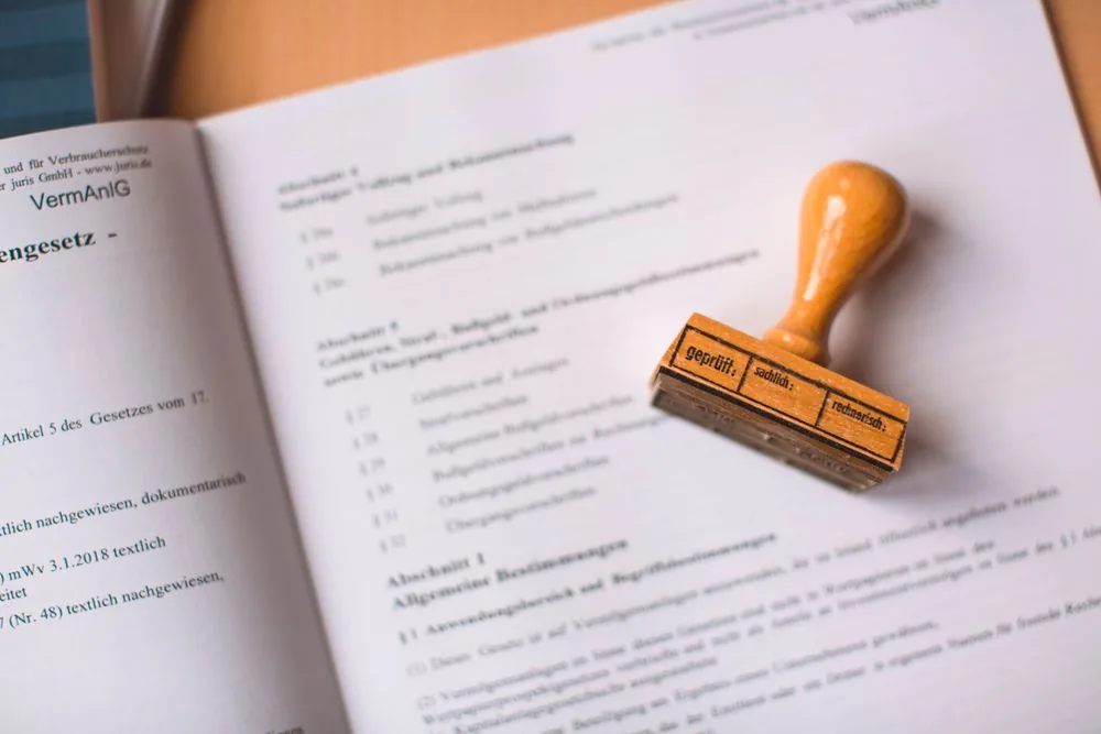 A notary stamp resting on an open book