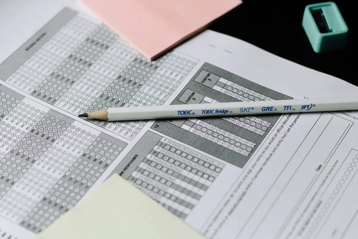 A pencil resting on a multiple-choice answer sheet