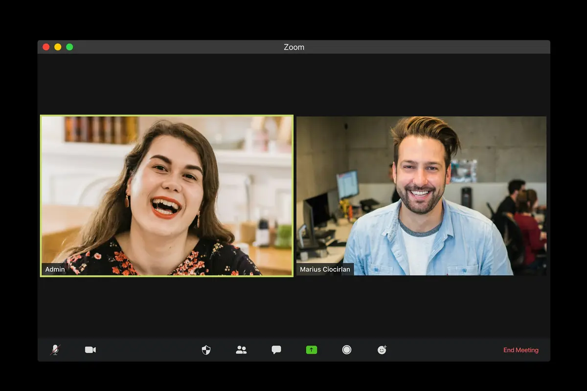 Two participants smiling during a live video lesson