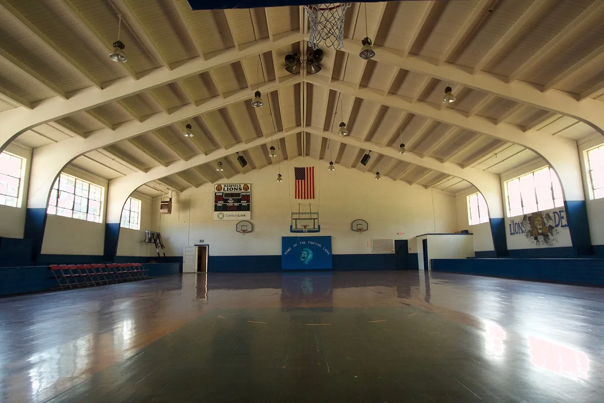The interior of a modern gym lined with training machines