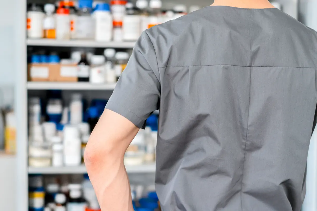 A pharmacist organising shelves of medication