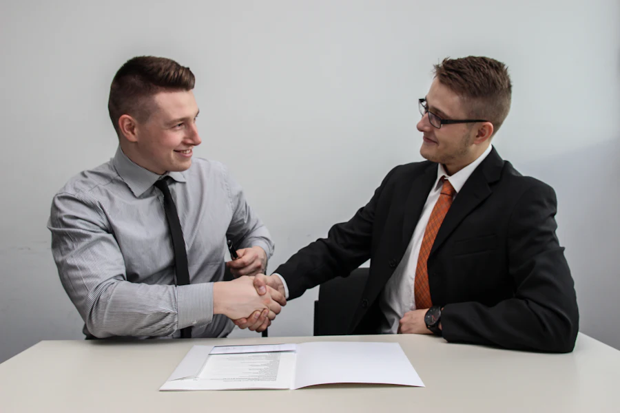 Two partners closing an agreement with a handshake